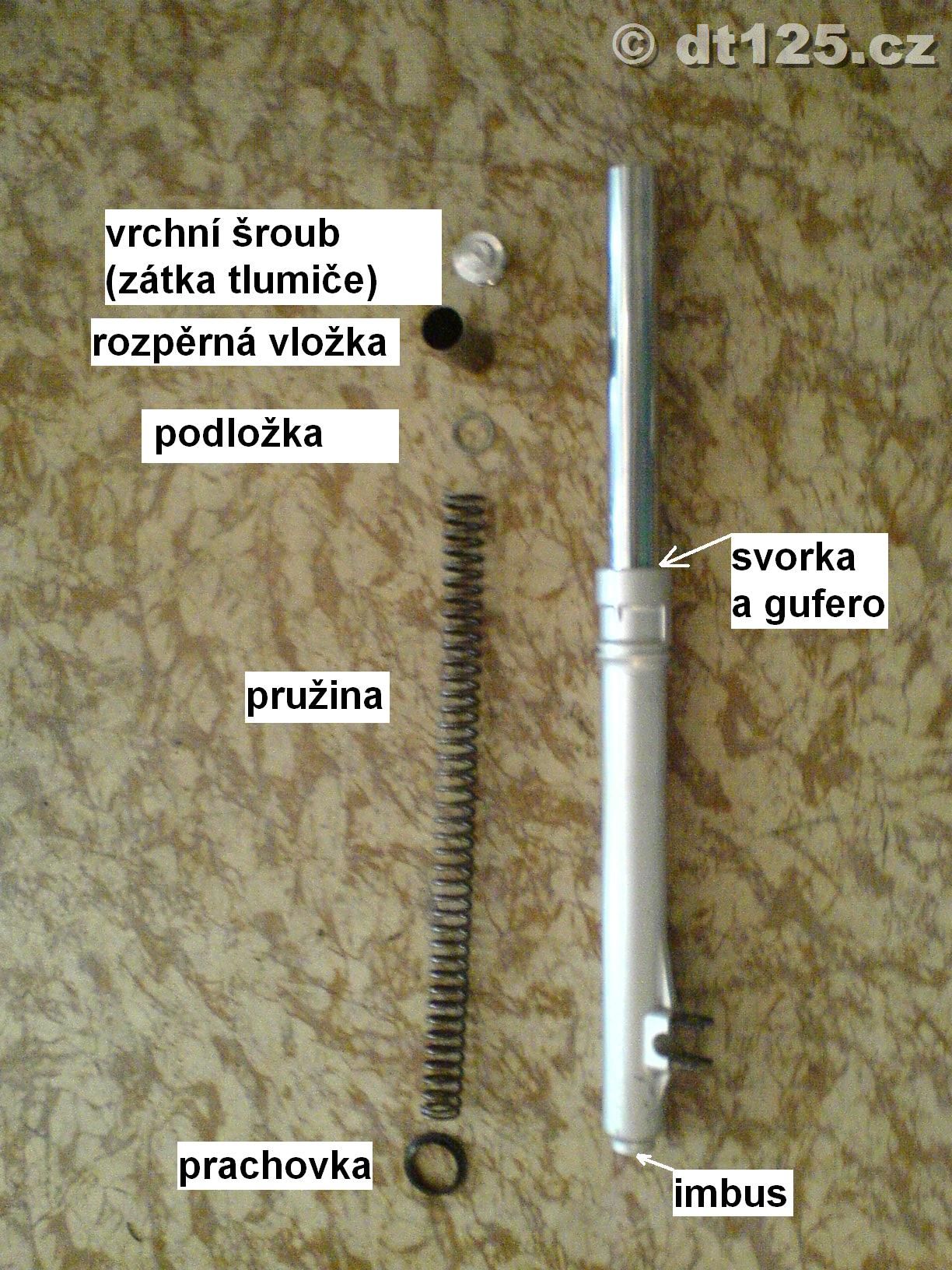 rozebraný přední tlumič